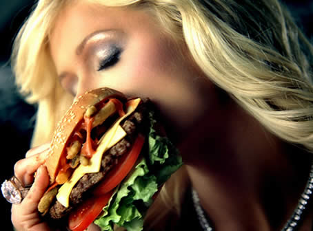 Paris Hilton: The Girl Can't Help It Paris Hilton does a Burger Commercial. So what's all the fuss about? Meat is Murder? Bentley Abuse? What?
